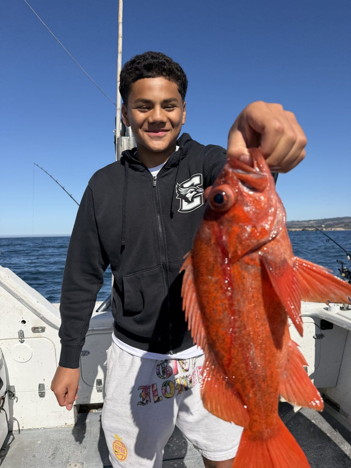 Young angler with a red fish